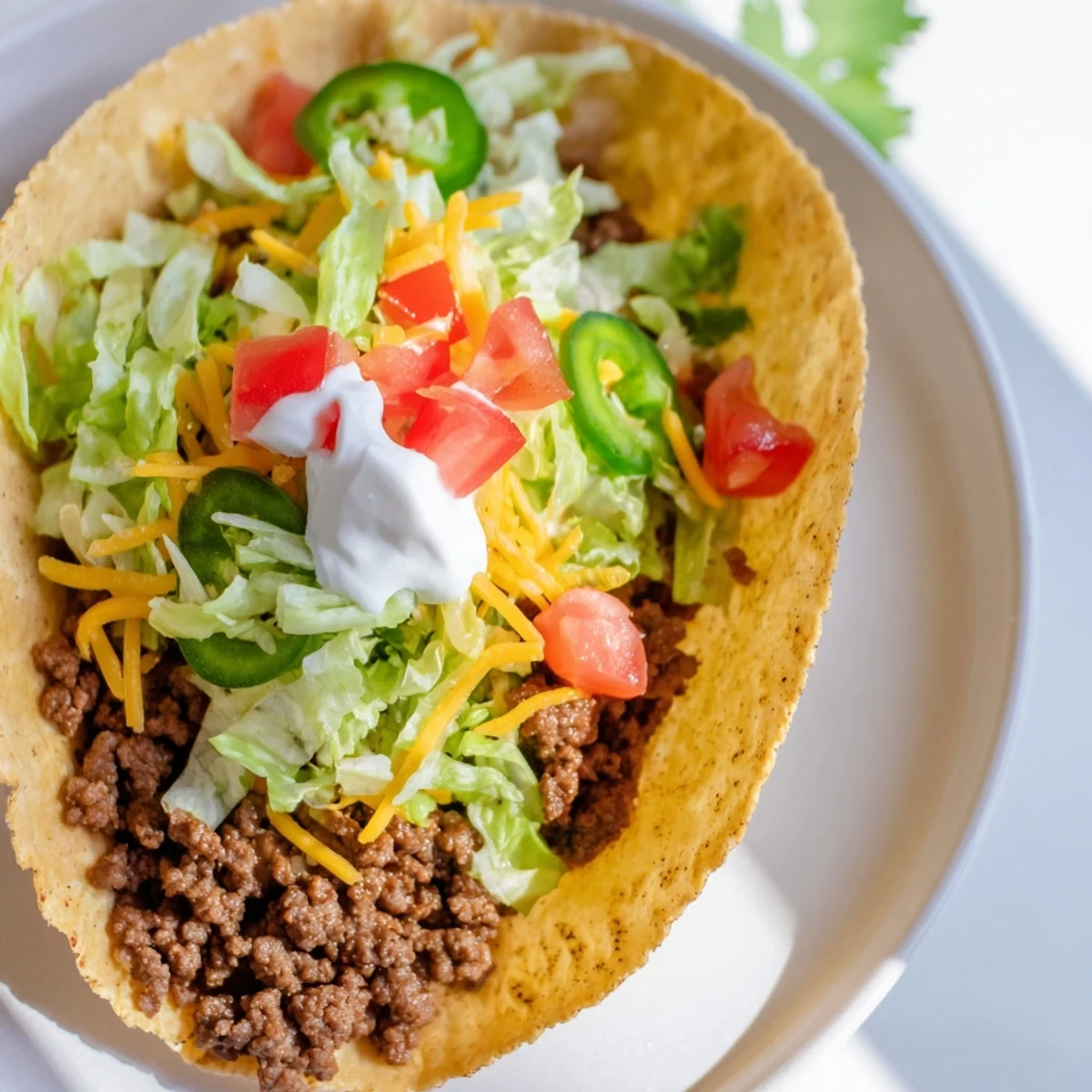 Juicy MVP Beef Tacos with Cheese are loaded with seasoned ground beef, melted cheddar, and fresh toppings on a warm corn shell.  