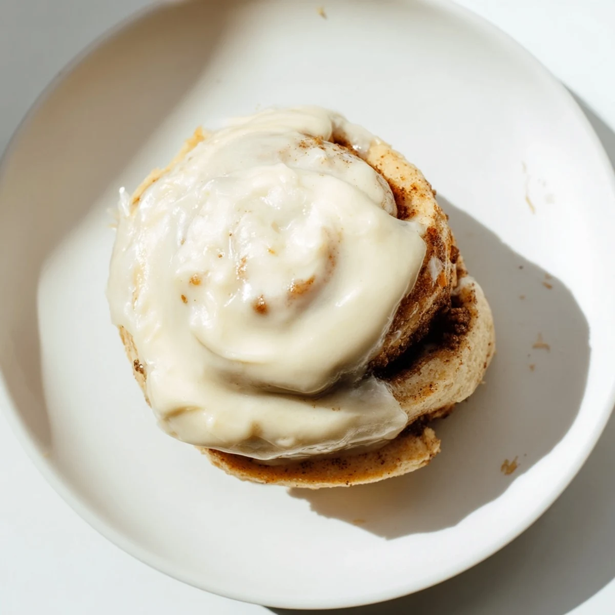 A close-up shot of keto cinnamon buns showing the swirls of cinnamon and sugary glaze, perfect for a low-carb snack.