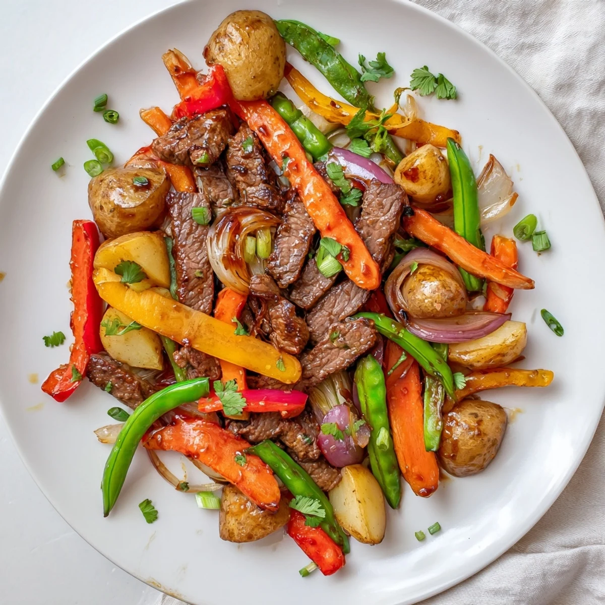 Close-up of the Blackstone Cowboy Stir Fry Dinner with colorful vegetables and fresh cilantro garnish, perfect for a hearty family meal.