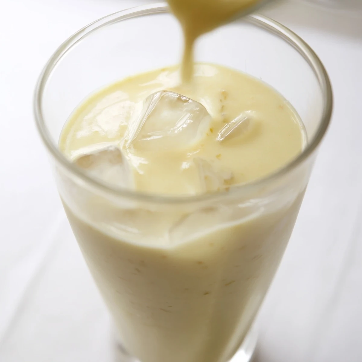 Thick tropical durian smoothie blended with banana and coconut milk for rich flavor