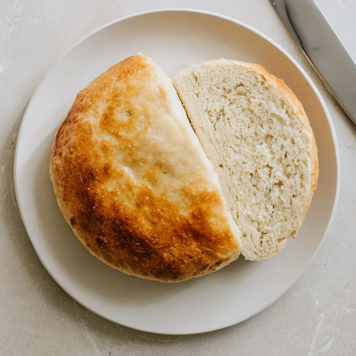 Homemade stovetop bread loaf sliced open revealing tender crumb, served warm