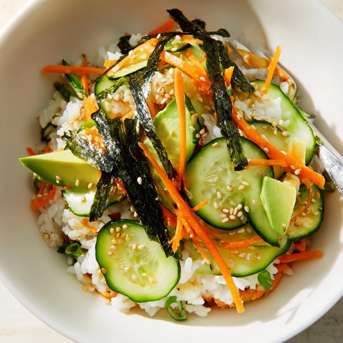 Bright Sushi Cucumber Salad tossed with seasoned rice and tangy-sweet dressing