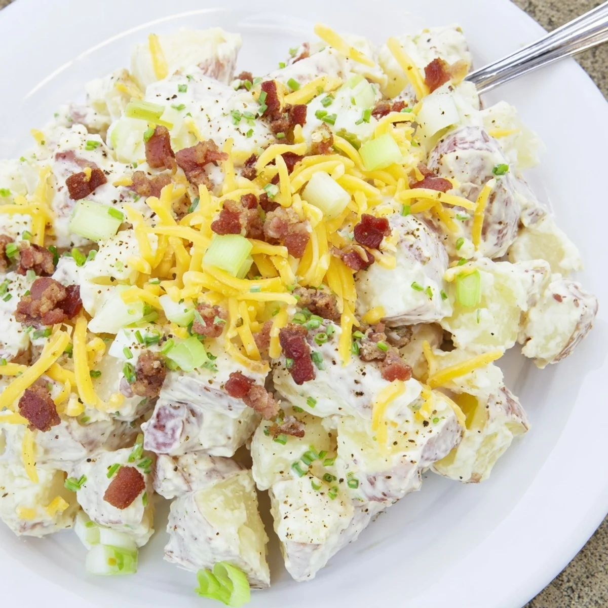 Creamy Beef Bacon Loaded Potato Salad with crispy bacon, tangy Dijon notes  
